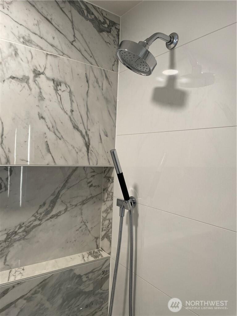 Double Shower heads and built in storage nook